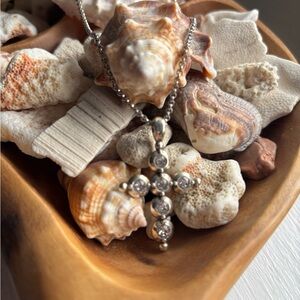 Brighton-Six shimmering Swarovski crystals create the cross silhouette. 
NWT